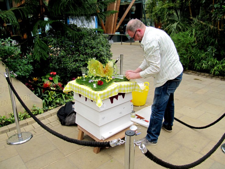 Anthony Bennett installs his sculptural intervention onto the hive.
